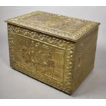 A Beaten Brass Coal Box Decorated with Tavern Scenes, 66cm Wide