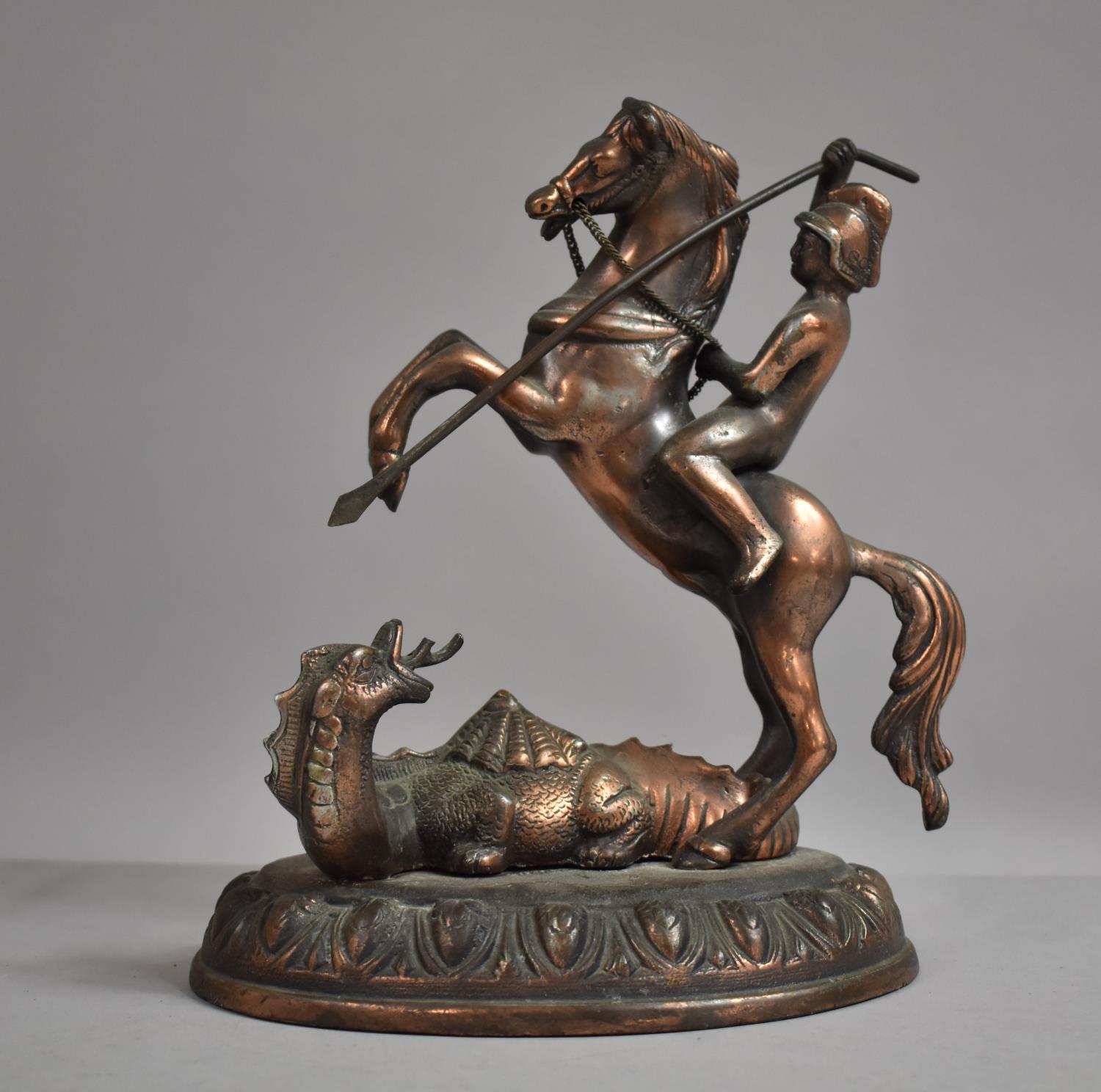 A Mid 20th Century Copper Plated Metal Study of St. George and the Dragon, 25cm high