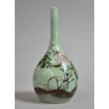 A Japanese Celadon Glazed Bottle Vase Decorated with Applied Enamels in Shallow Relief Depicting