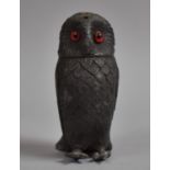 A Novelty Pewter Pepper Pot Modelled as an Owl with Glass Eyes, 10cm high