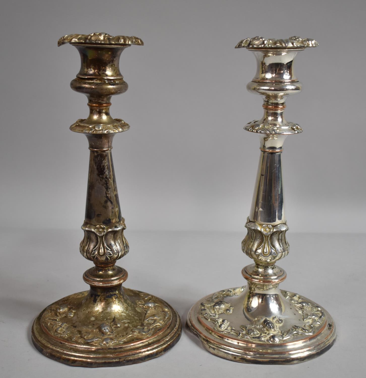 A Pair of Sheffield Plated Candlesticks on Circular Bases, Moulded Decoration, 23cm high