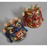 Two Moulded Papier Mache Far Eastern Masks with Painted Decoration