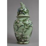 A Large Lidded Japanese Celadon Glazed Vase with Applied Enamels In Shallow Relief Depicting Birds