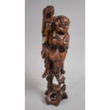 A Chinese Root Carving Depicting Fisherman with Fish, 35cm high