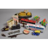 A Collection of Curios to Include Two Vintage Rubik Cubes, Lifeboat Ornament, Diecast Toys, American