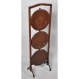 An Edwardian Mahogany Three Tier Cake Stand, 90cm high