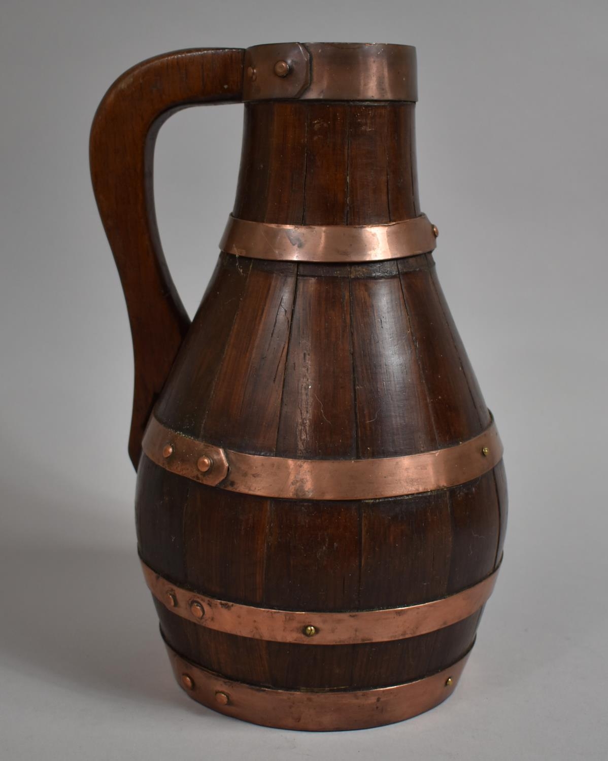 A Late 19th/Early 20th Coopered Oak Jug with Copper Hoops, 30cm high