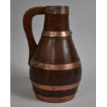 A Late 19th/Early 20th Coopered Oak Jug with Copper Hoops, 30cm high