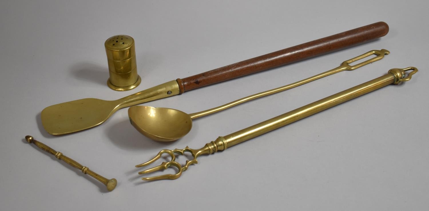 A Long Brass Ladle, Brass Toasting Fork, Brass and Wooden Spoon and a Brass Wig Duster