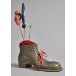 A Late 19th Century Novelty Pin Cushion in the Form of a Boot and Containing Four Later Hat Pins,