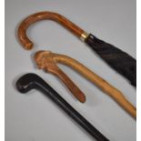 A Novelty Carved Walking Stick with Mask Handle, Sunday Morning Golf Stick and Umbrella