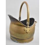 A Brass Helmet Shaped Coal Scuttle