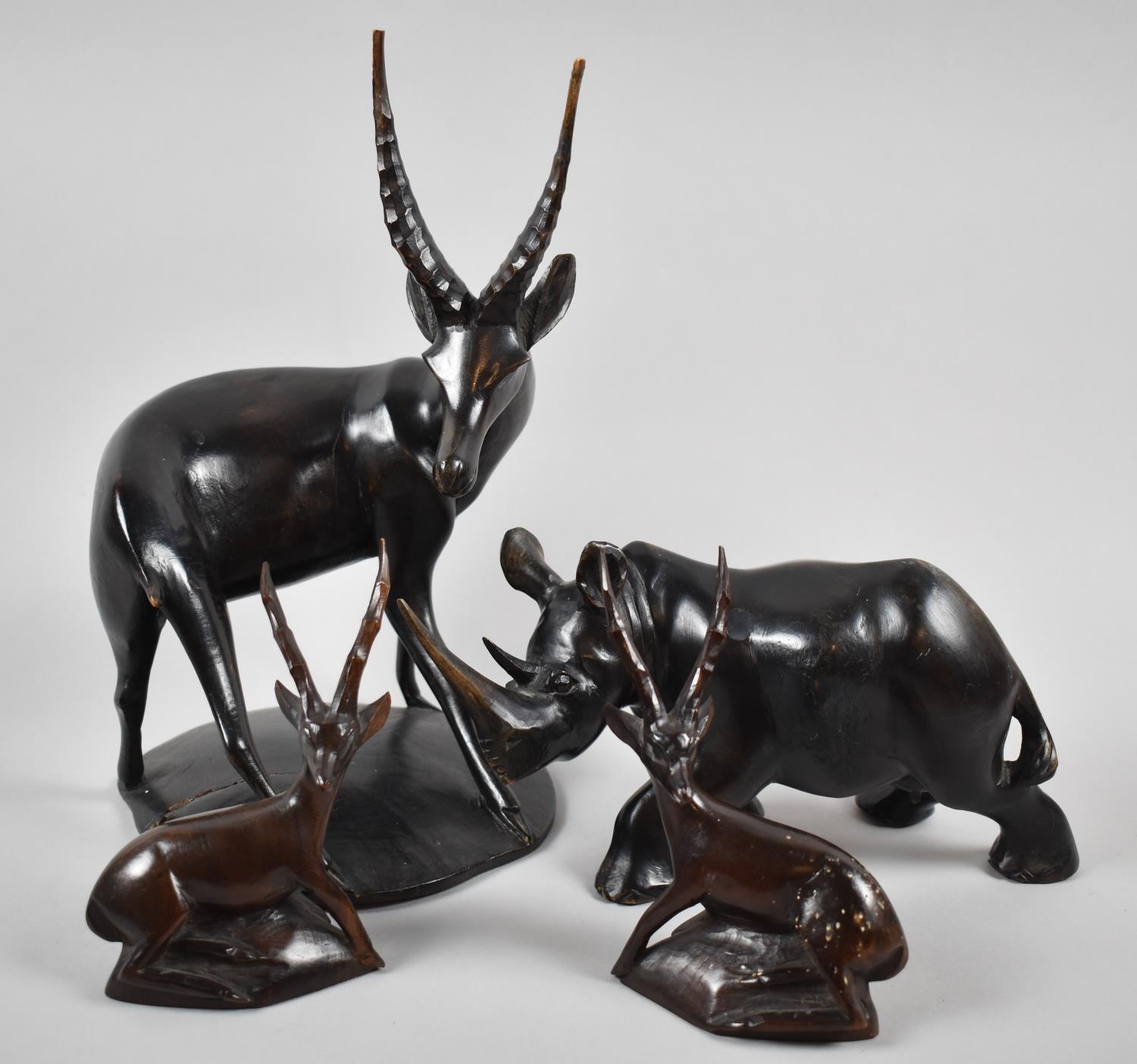 A Collection of Carved Wooden African Souvenir Animals to Include Rhino and Antelopes