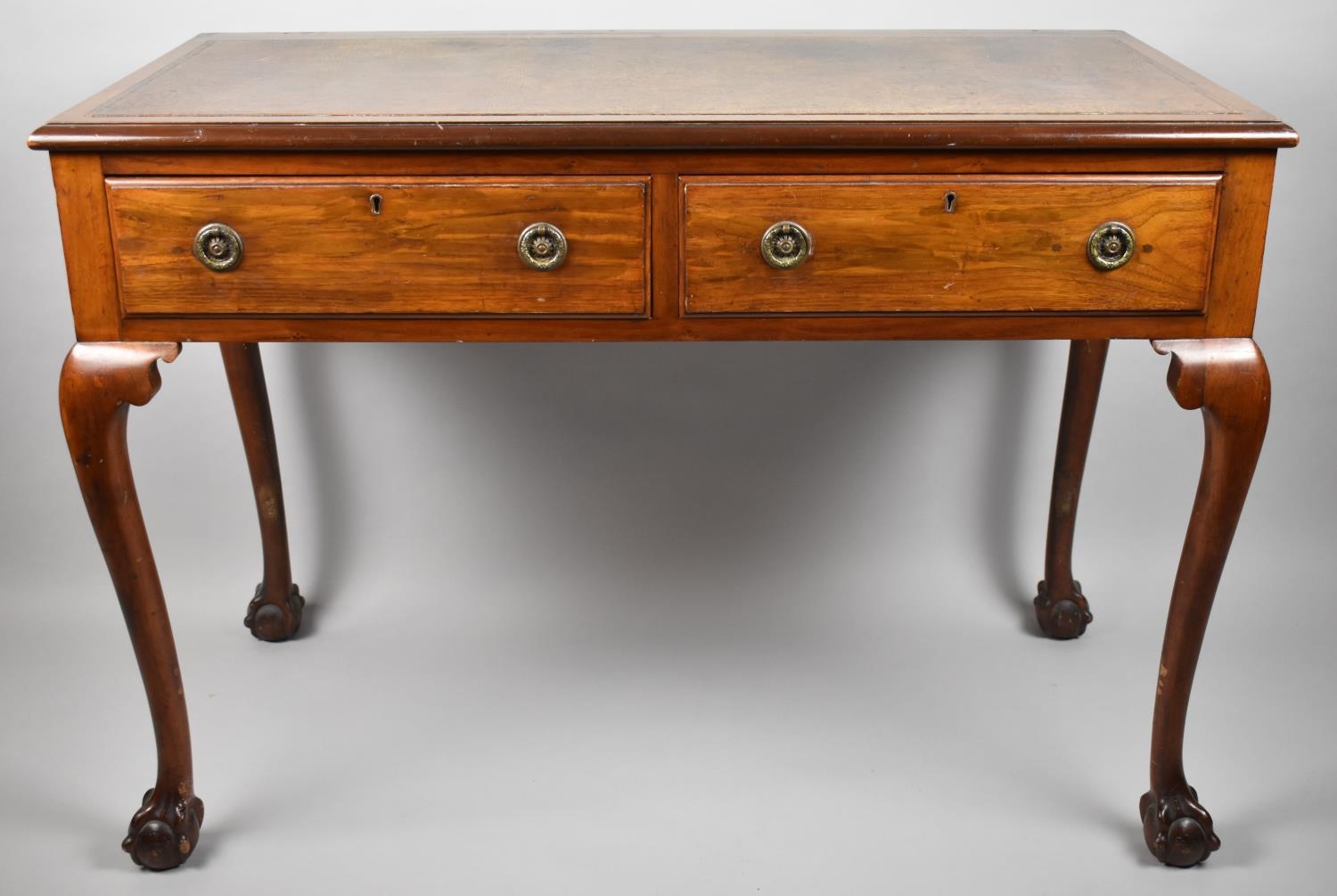 A Mid 20th Century Writing Desk with Tooled Leather Top, Two Drawers and Cabriole Support