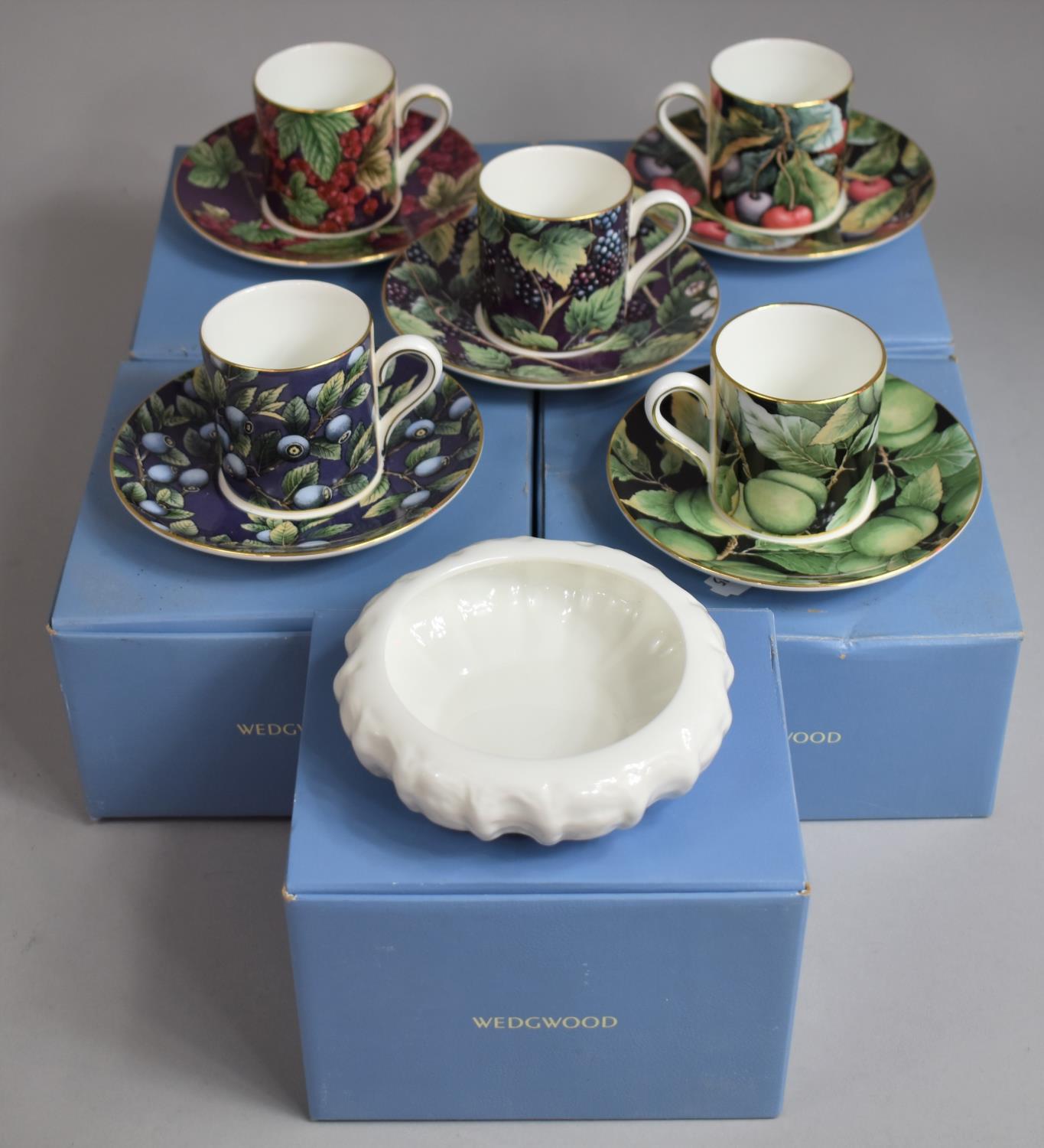 A Set of Five Wedgwood Coffee Cans and Saucers, Fruit Orchard Collection, Together with a Wedgwood