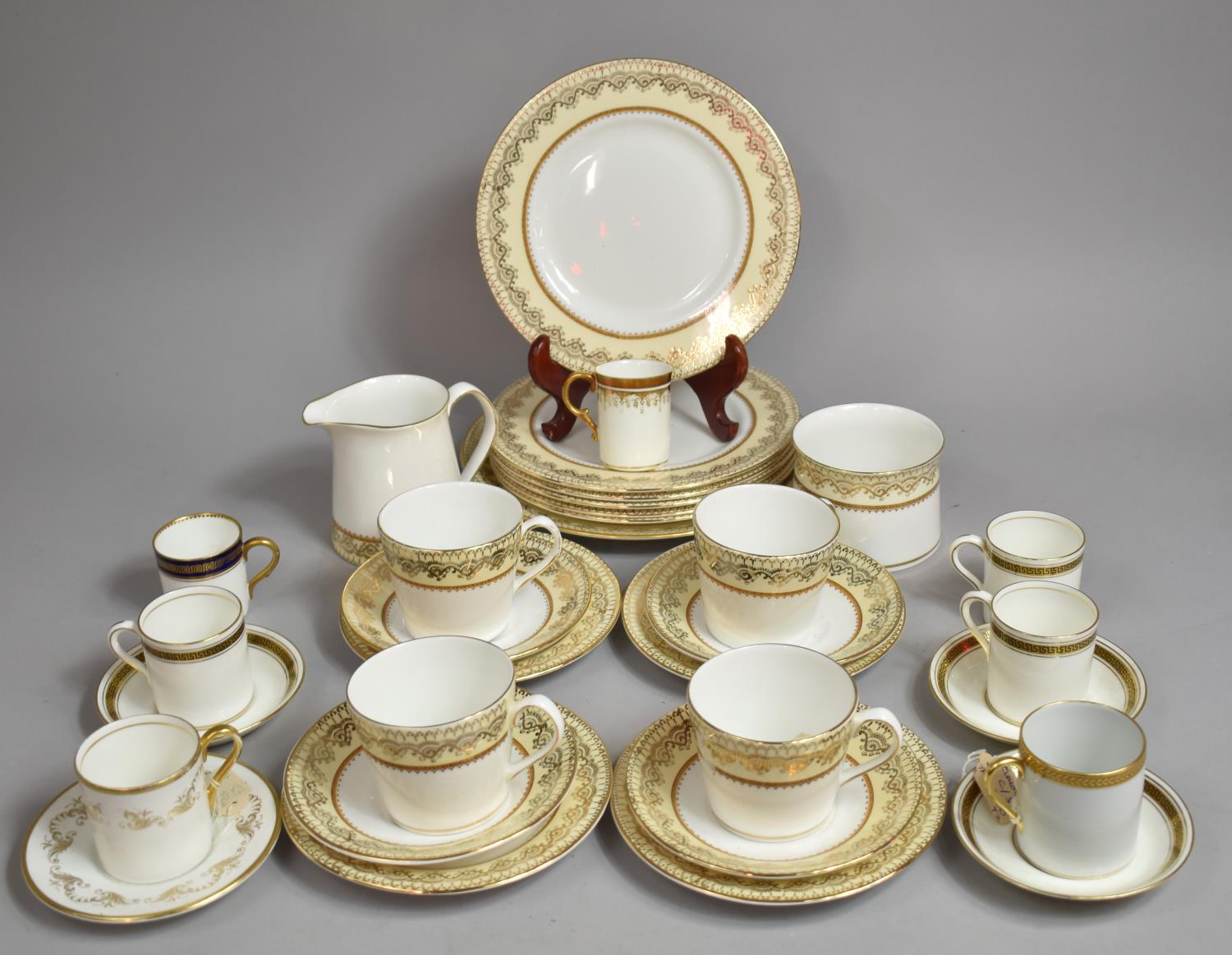 An Elizabethan Swiss Cottage Gilt and Cream Decorated Tea Set together with Further Gilt Decorated