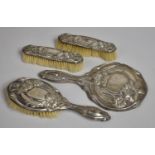 A Four Piece Silver Mounted Dressing Table Set with Floral Relief Decoration, Hallmarked