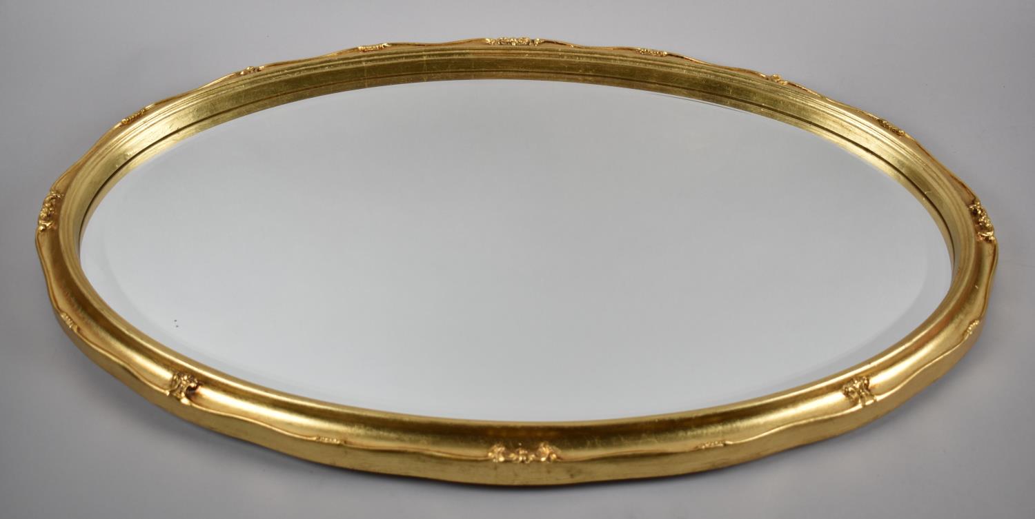 A Gilt Framed Oval Wall Mirror, 70x43cm