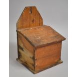 A Rustic 19th Century Stained Pine Wall Hanging Salt Box with Sloping Hinged Lid, 26cm high