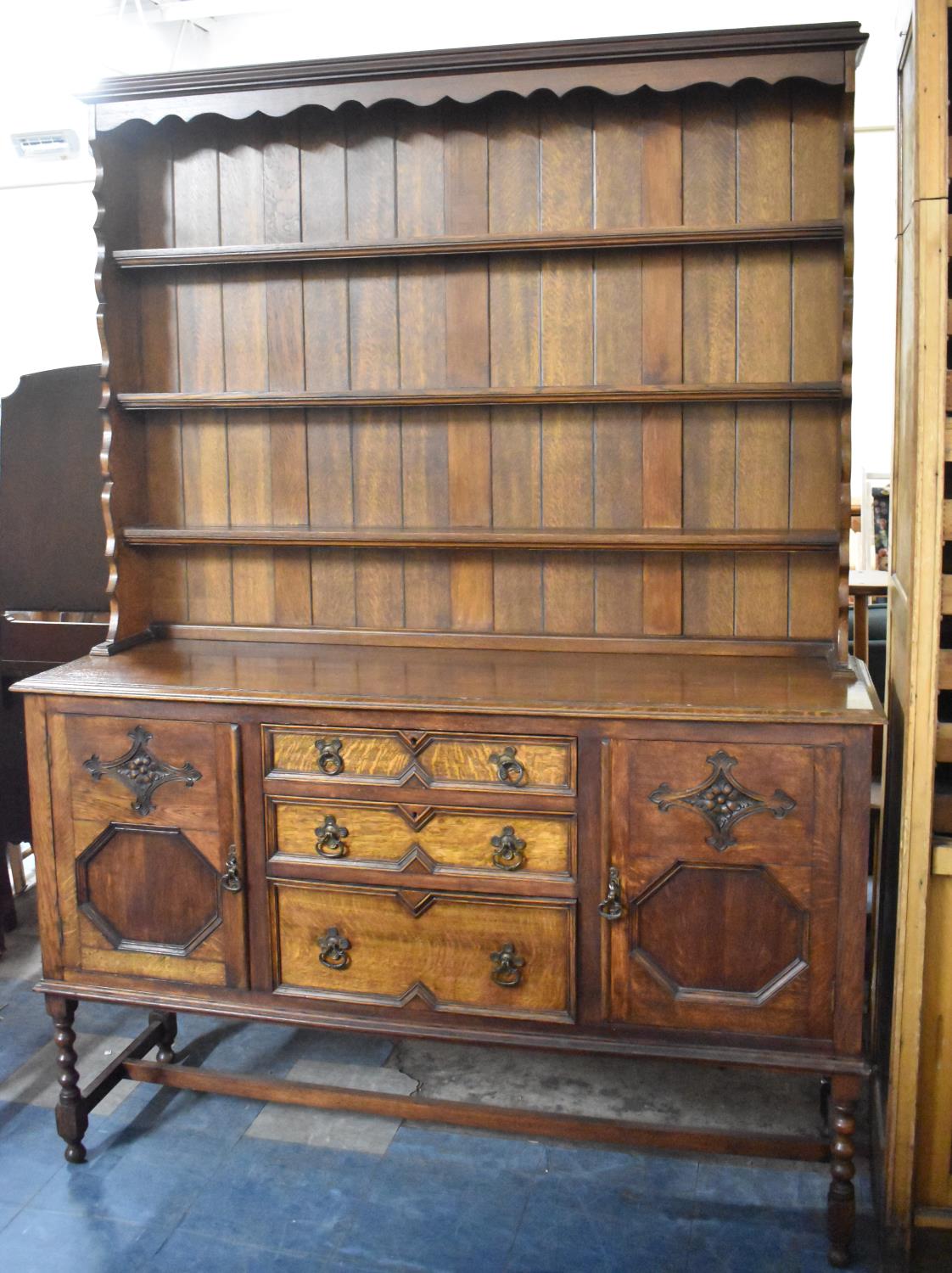 A Mid 20th Century Oak Dresser the Base Section with Three Graduated Centre Drawers Flanked by