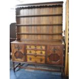 A Mid 20th Century Oak Dresser the Base Section with Three Graduated Centre Drawers Flanked by