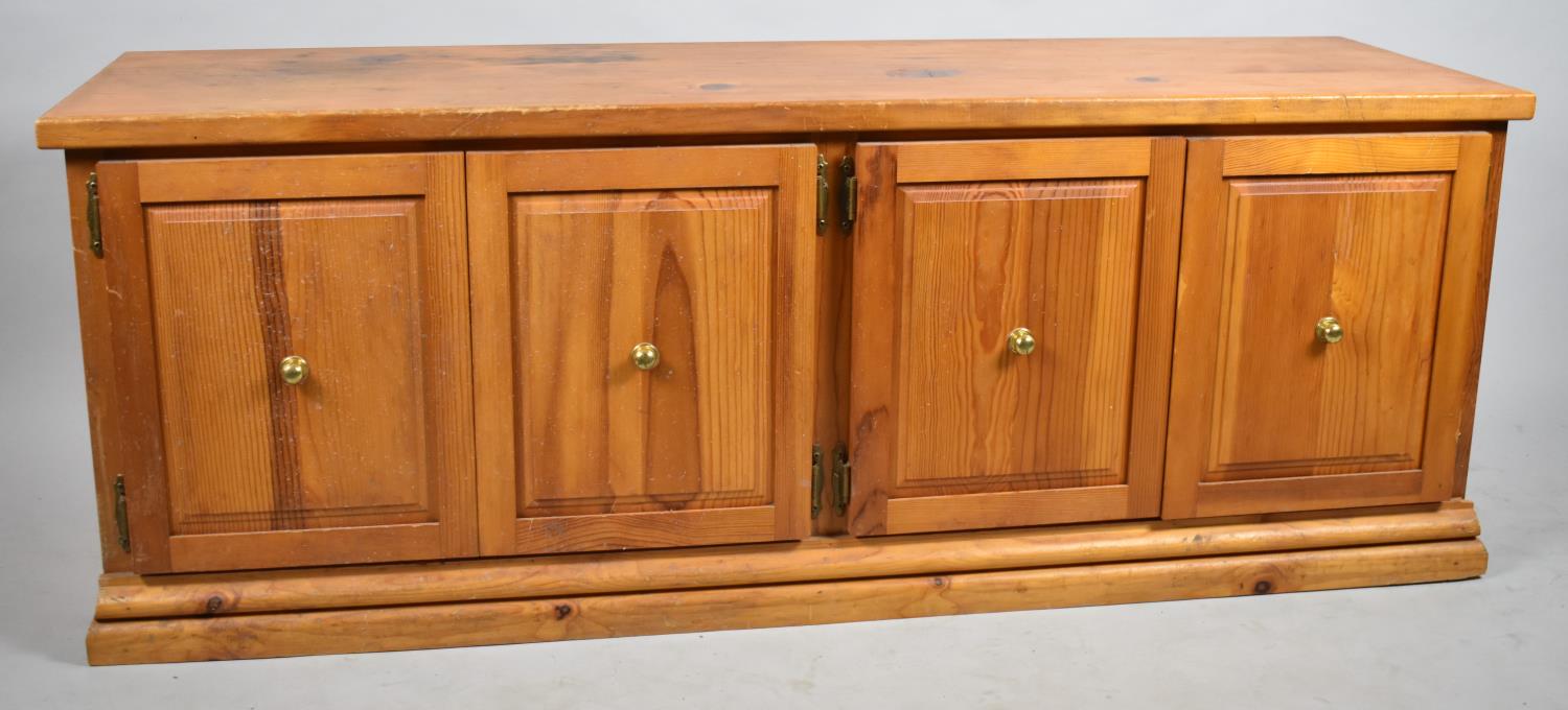A Modern Pine Side Cabinet with Four Panelled Doors, 140cm long and 52cm High