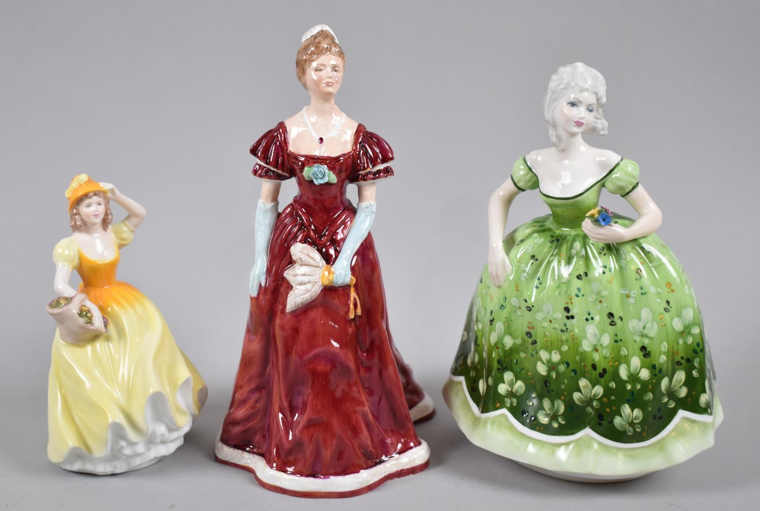 A Collection of Three Figural Ornaments to Include two Coalport Examples