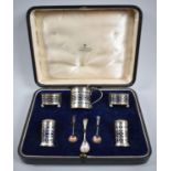 A Silver Five Piece Cruet Set with Three Spoons