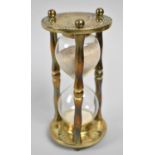 A Cylindrical Brass Hourglass, 16cm high