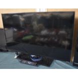 A Samsung 37" TV with Remote