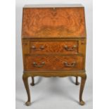 A Mid 20th Century Walnut Fall Front Two drawer Bureau on Short Cabriole Supports, 60.5cm wide