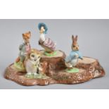 A Collection of Four Beswick Potter Figures, BP2 Together with a Tree Trunk Stand