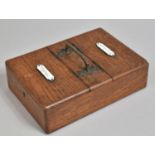 A Late Victorian/Edwardian Oak Two Division Cigars and Cigarette Box with Central Carrying Handle,