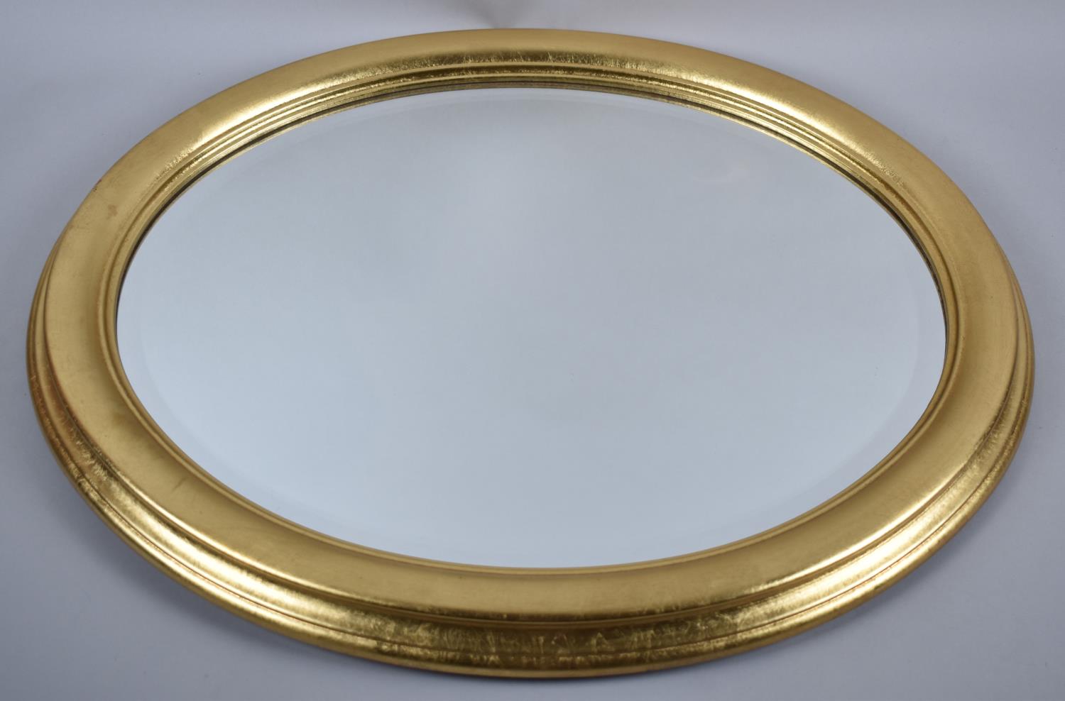 A Gilt Framed Oval Wall Mirror, 58x48cm