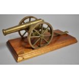 A Brass Model of Field Cannon Mounted on Stepped Oak Plinth, 33cm Wide