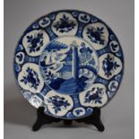 An Early Tin Glazed Delft Blue and White Charger, Has Been Glued and Rim Badly Rubbed, 34cm Diameter