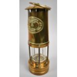 A 1981 Brass Miners Safety Lamp by E Thomas & Williams Ltd, Aberdare, Wales, no. 64987, 25cm High