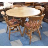 A Circular Pine Breakfast Table and Four Spindle Back Chairs, Table 117cm Wide