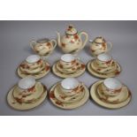 A Japanese Egg Shell Tea Set Decorated with Blossoming Branches and Pagoda Scene to Comprise Cups,