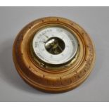 An Edwardian Bleached Walnut Circular Aneroid Barometer, 18cm Diameter