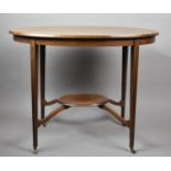 An Edwardian Oval Walnut and Mahogany Occasional Table with Oval Stretcher Shelf