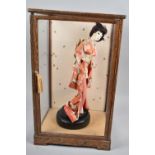 A Mid 20th Century Cased Japanese Doll, Two Glass Panels Missing, 49cm high
