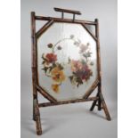 An Edwardian Bamboo Framed Fire Screen With Painted Flower Centre, 52cm wide