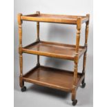 A Mid 20th Century Mahogany Three Tier Trolley with Turned Supports, 60cm Long