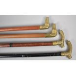 A Collection of Four Brass Handled Walking Canes