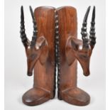 A Pair of Carved African Souvenir Bookends of Antelope, 28cm high