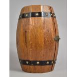 A Continental Novelty Wooden Tantalus in the Form of a Barrel Containing Two Amber Glass Decanters