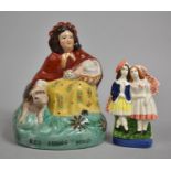 A Reproduction Staffordshire Red Riding Hood and Scottish Couple, 20cm high