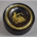 A 19th Century Continental Lacquered Papier Mache Circular Snuff Box, the Lid Decorated with