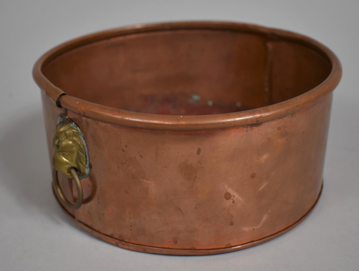 A Circular Copper Planter with Brass Lion Mask Handles, 20cm Diameter